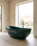 Imperial stone bathing vessel in a wabi-sabi bathroom — Atelier Earthmade