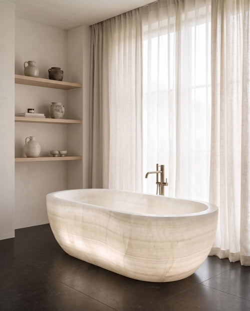 Alba stone bathing vessel in a wabi-sabi bathroom — Atelier Earthmade