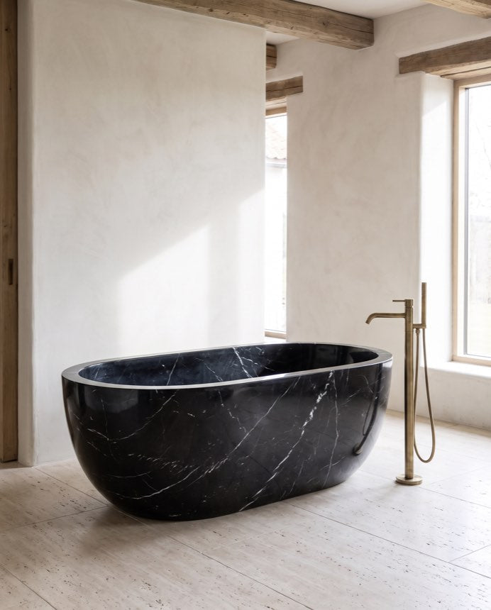 Nero stone bathing vessel in a wabi-sabi bathroom — Atelier Earthmade